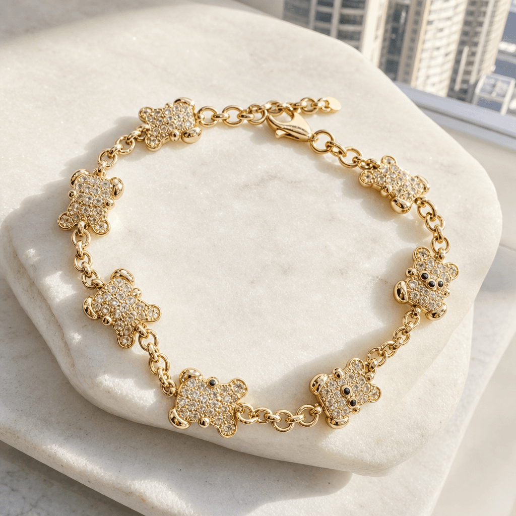Solid 14K gold pavé teddy bear charm bracelet on stone, Jade Gold NYC.